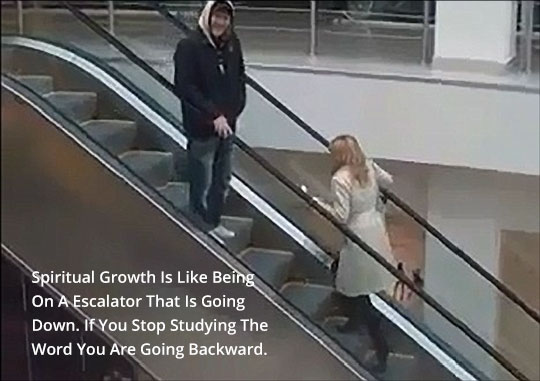 Woman walking backwards on escalator